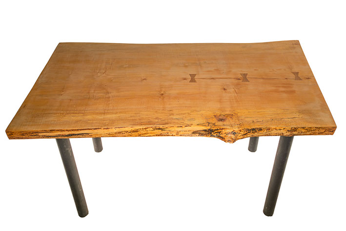 A Large solid wood Desk from Humboldt Hardwoods. This Table is crafted from a maple and features a lived edge.